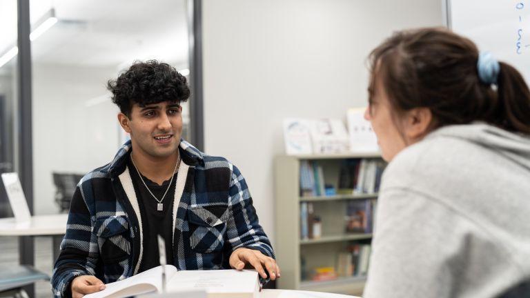 student tutoring another student